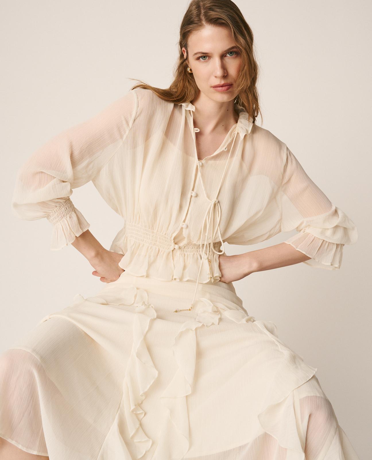 BLUSA SEMITRANSPARENTE VOLANTES