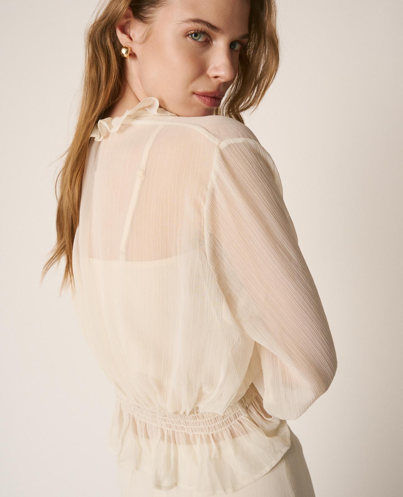 BLUSA SEMITRANSPARENTE VOLANTES