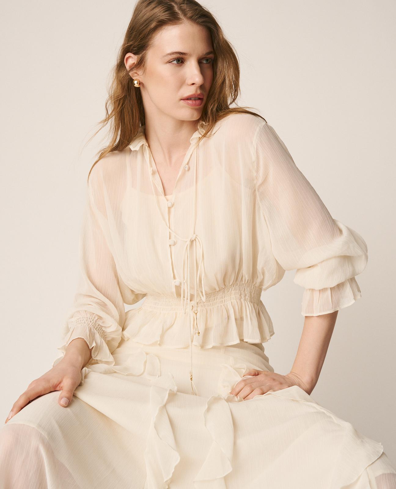 BLUSA SEMITRANSPARENTE VOLANTES