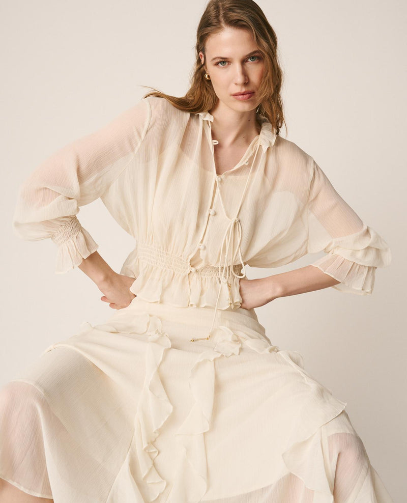 BLUSA SEMITRANSPARENTE VOLANTES