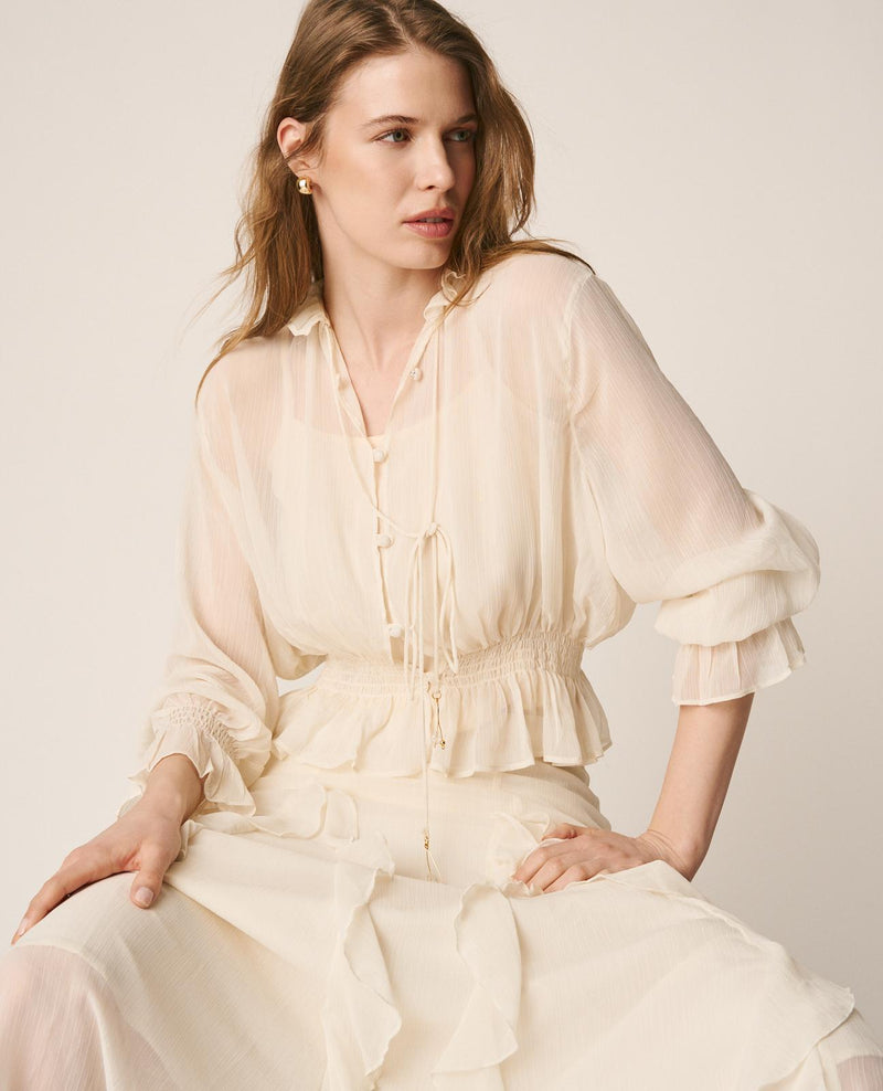 BLUSA SEMITRANSPARENTE VOLANTES