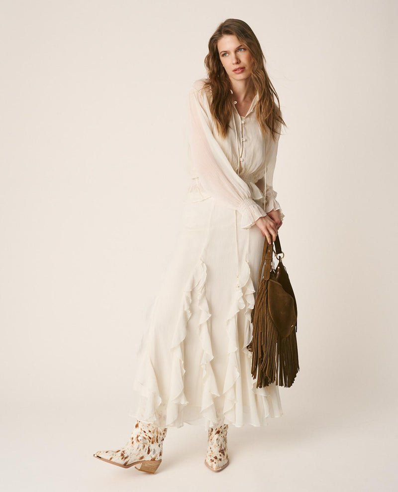 BLUSA SEMITRANSPARENTE VOLANTES